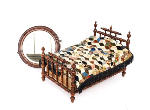 A BOBBIN TURNED ROSEWOOD DOLL’S BED OR APPRENTICE PIECE (2)