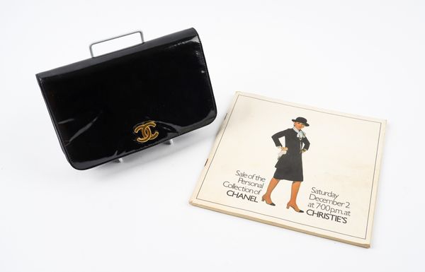 CHANEL: A SMALL BLACK PATENT LEATHER FLAP BAG AND A CHRISTIE'S AUCTION CATALOGUE (2)