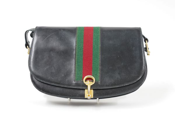 GUCCI: A BLACK LEATHER CROSS BODY BAG WITH CANVAS GREEN AND RED STRIPE