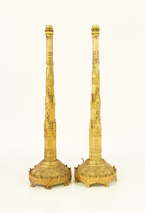 A PAIR OF EMBOSSED GILT-BRASS GOTHIC TABLE LAMPS (2)