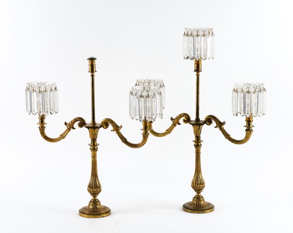 A PAIR OF LATE REGENCY GILT-BRASS AND GLASS THREE-LIGHT CANDELABRA (2)