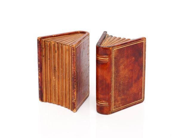 ASPREY & CO. LTD.; A PAIR OF RED LEATHER BOOK ENDS MODELLED AS BOOKS