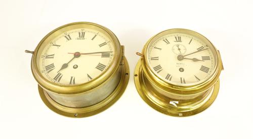 TWO BRASS SHIPS’ BULK HEAD TIMEPIECES (2)
