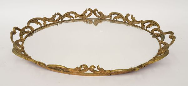 A GILT-METAL MOUNTED MIRROR GLASS TWIN HANDLED TRAY