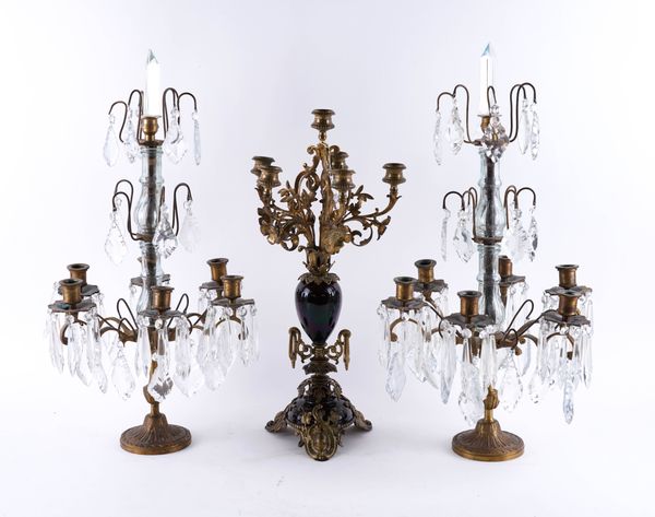 A 19TH CENTURY GILT-BRASS AND RED GLAZED CERAMIC SIX LIGHT CANDELABRA (3)