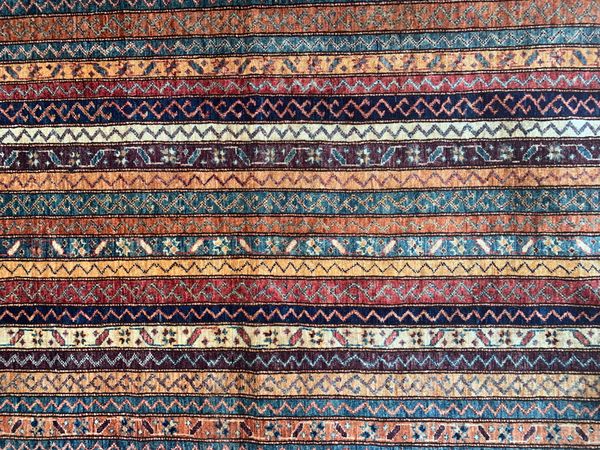 AN AFGHAN CARPET