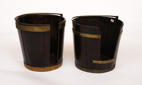 A NEAR PAIR OF GEORGE III BRASS BOUNDED COOPER MADE MAHOGANY PLATE BUCKETS (2)