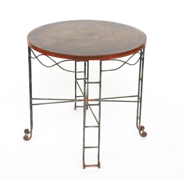 A 20TH CENTURY LEATHER INSET CIRCULAR OCCASIONAL TABLE