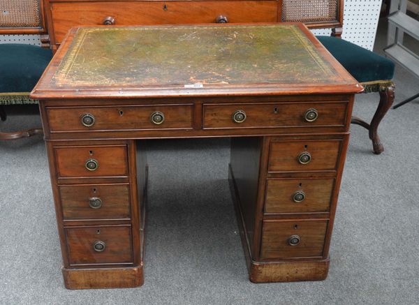 A SMALL 19TH CENTURY MAHOGANY PEDESTAL DESK