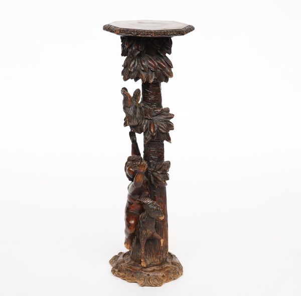 A 19TH CENTURY BLACK FOREST CARVED LIMEWOOD JARDINIERE