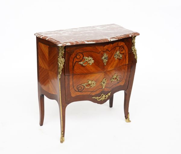 A LOUIS XV STYLE GILT METAL MOUNTED MARBLE TOPPED ROSEWOOD AND WALNUT BOMBE TWO DRAWER COMMODE