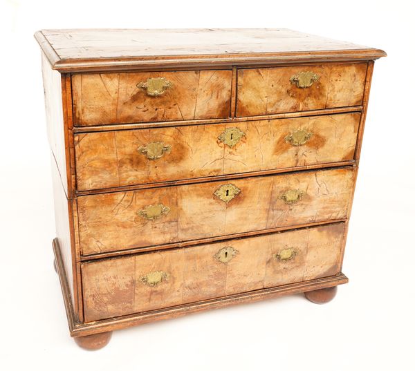 AN EARLY 18TH CENTURY FIGURED WALNUT CHEST OF  DRAWERS ON BUN FEET