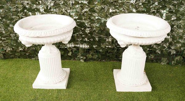 A PAIR OF 19TH CENTURY TERRACOTTA PAINTED LION MASK PLANTERS ON FLUTED PEDESTALS (2)