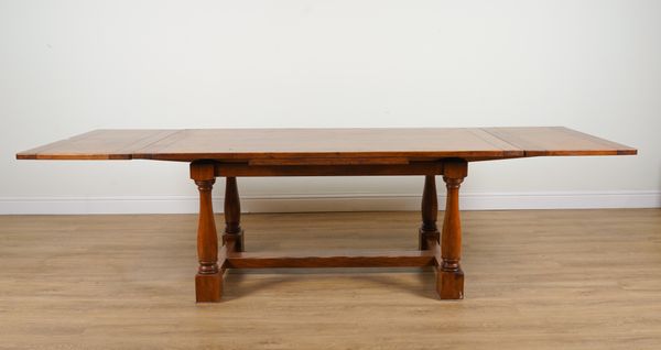 WILLIS & GAMBIER; AN OAK DRAWER LEAF EXTENDING DINING TABLE