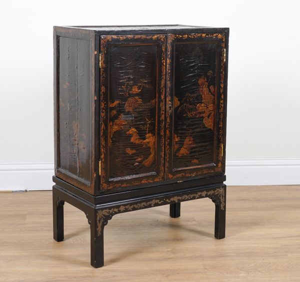 A 19TH CENTURY CHINESE EXPORT BLACK LACQUER CHINOISERIE CABINET ON STAND