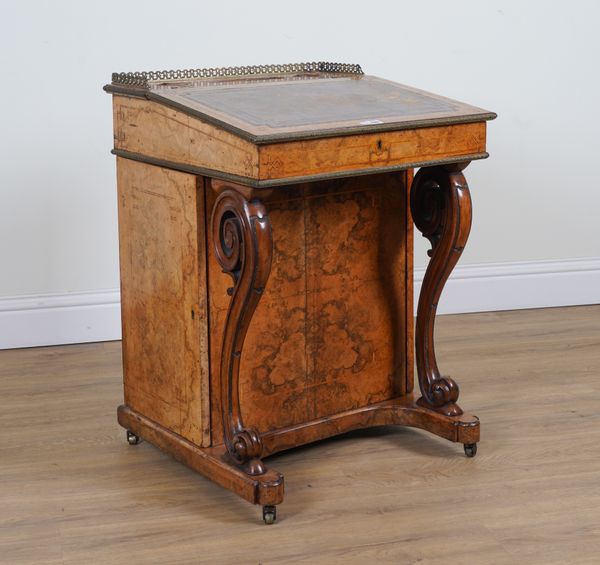 A VICTORIAN FIGURED WALNUT DAVENPORT