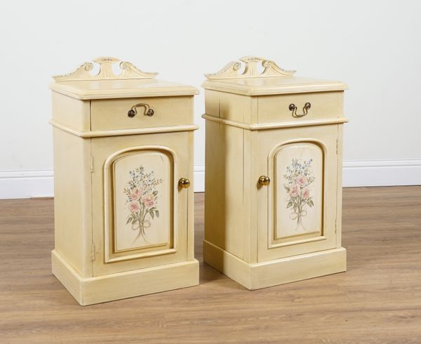 A PAIR OF CREAM PAINTED BEDSIDE CUPBOARDS (2)