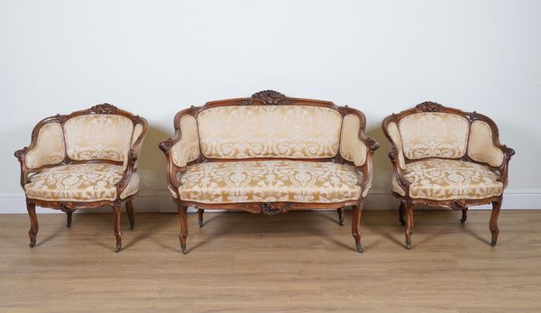 A LOUIS XV STYLE CARVED WALNUT FRAMED THREE-PIECE SALON SUITE  (3)