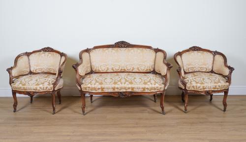 A LOUIS XV STYLE CARVED WALNUT FRAMED THREE-PIECE SALON SUITE  (3)