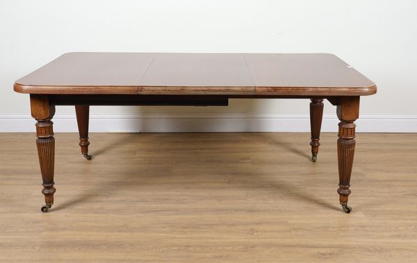 A VICTORIAN MAHOGANY EXTENDING DINING TABLE