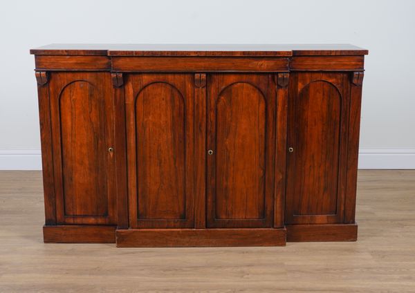 AN EARLY VICTORIAN ROSEWOOD BREAKFRONT FOUR DOOR SIDE CABINET