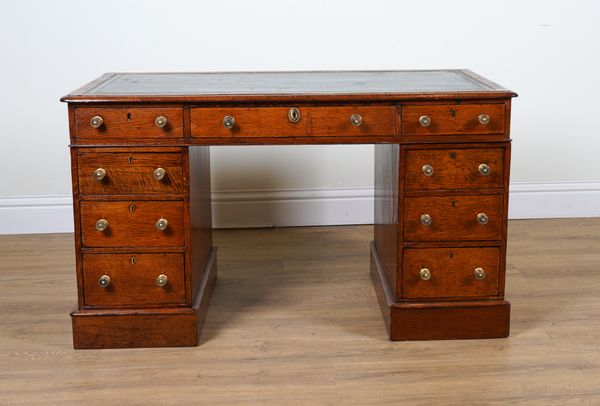 A VICTORIAN OAK PEDESTAL DESK