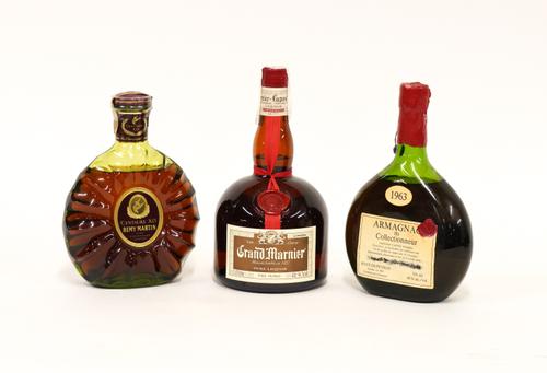 THREE BOTTLES INCLUDING REMY MARTIN CENTAURE XO FINE COGNAC, GRAND MARNIER AND BREVET ARMAGNAC 1963  (3)