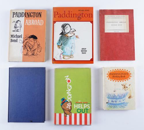 BOND, Michael (1926-2017). Paddington Abroad, London, 1961, 8vo, original cloth, dust-jacket, FIRST EDITION, inscribed, "To Nina, with best thanks, Michael." With 5 other Paddington books, one a PRESENTATION COPY, and a typed letter from the author. (7)