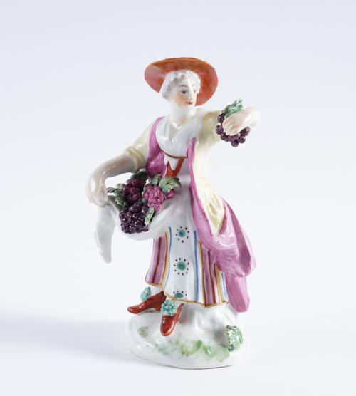 A DERBY FIGURE OF A WOMAN SELLING FRUIT