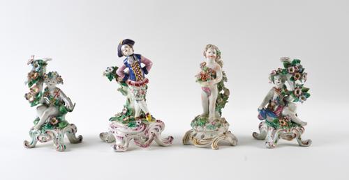 A BOW CANDLESTICK FIGURE OF A DUTCH DANCER