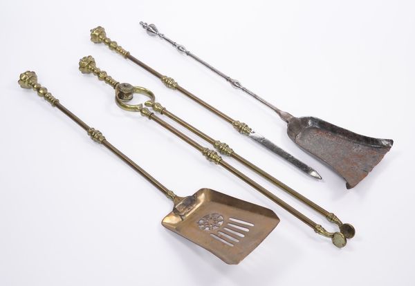 A GEORGE III STEEL SHOVEL TOGETHER WITH A SET OF THREE BRASS FIRE TOOLS (4)