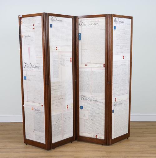 AN EARLY 20TH CENTURY OAK FRAMED FOUR FOLD DRAUGHT SCREEN