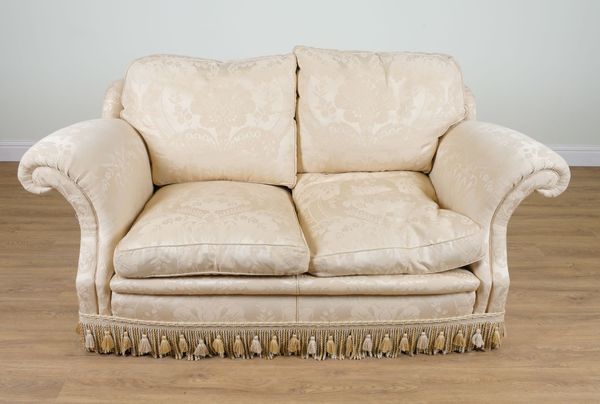 A MODERN TWO SEAT SOFA IN FLORAL GOLD PATTERN UPHOLSTERY