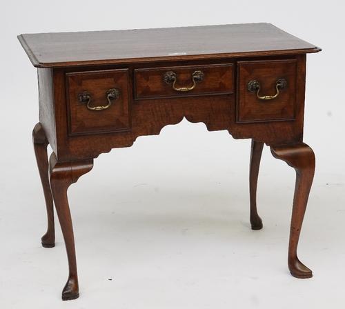 A MID-18TH CENTURY OAK AND MAHOGANY LOWBOY