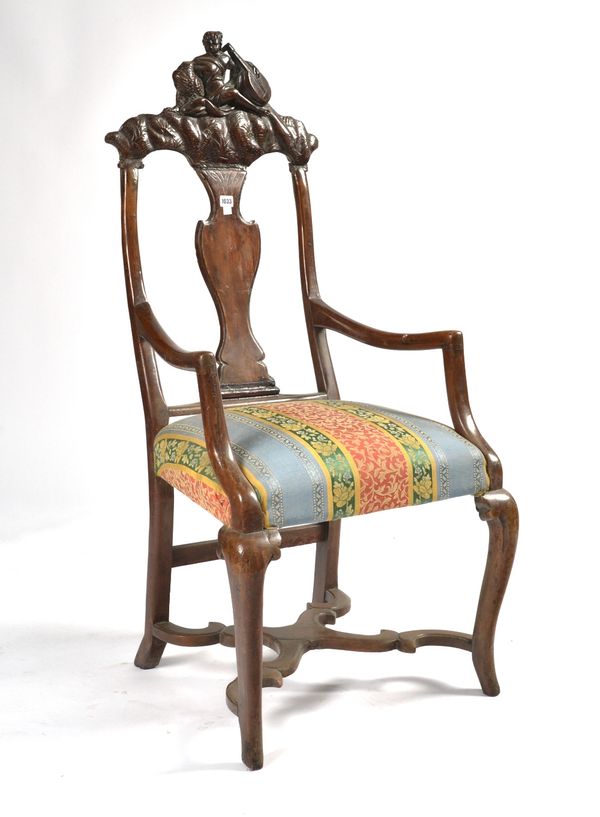 AN 18TH CENTURY ITALIAN CARVED WALNUT OPEN ARMCHAIR