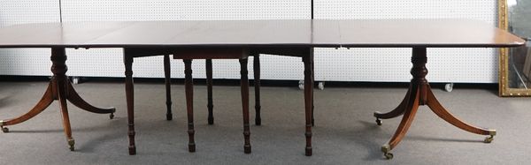 A MAHOGANY TRIPLE SECTION DINING TABLE