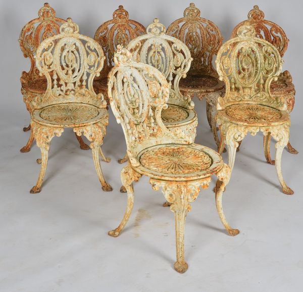 A SET OF EIGHT WHITE PAINTED CAST IRON GARDEN SEATS (8)