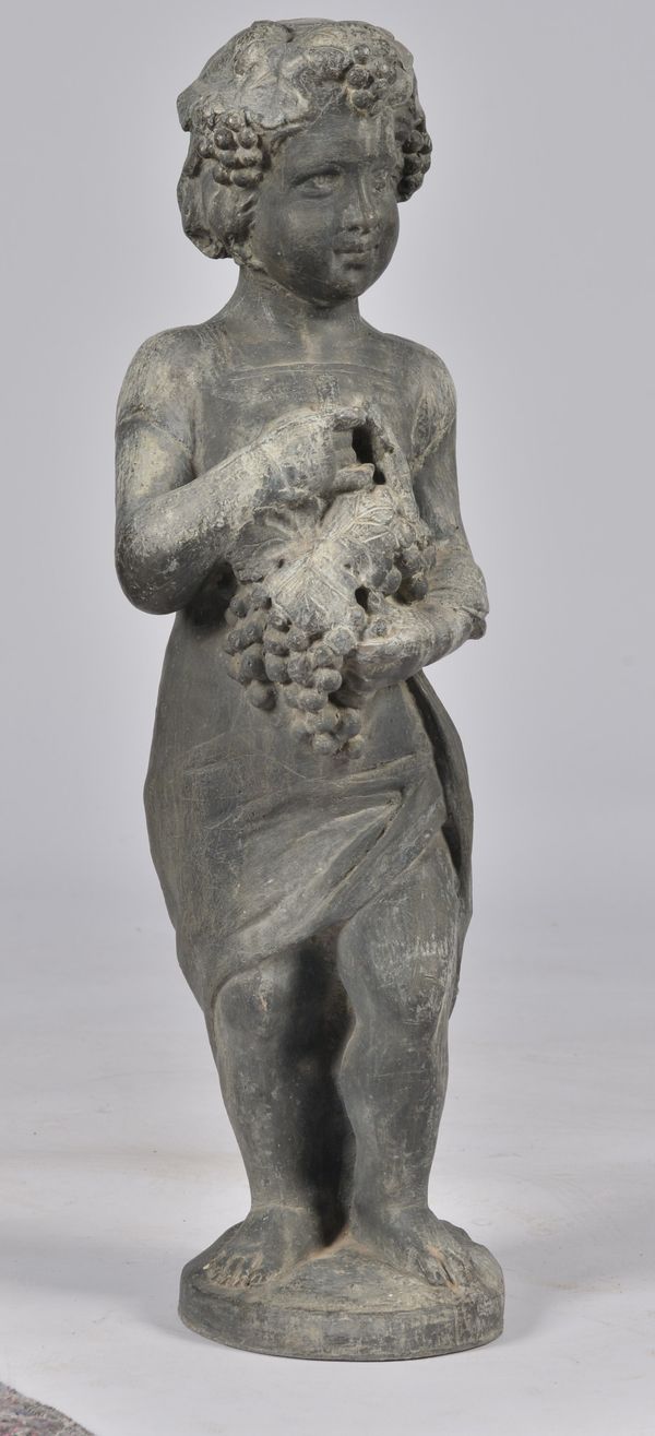 A LEAD FIGURE OF A ROBED YOUNG BACCHUS