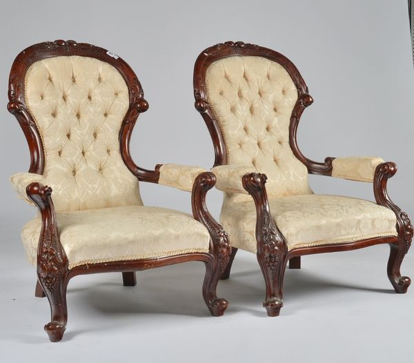 A PAIR OF HARDWOOD FRAMED OPEN ARMCHAIRS (2)