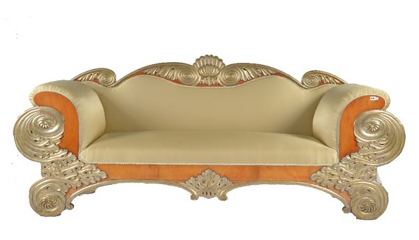 AN EARLY 19TH CENTURY BIEDERMEIER PARCEL GILT AND CHERRY SOFA