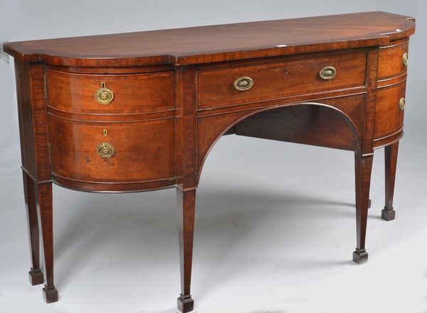 A GEORGE III MAHOGANY BREAKFRONT SIDEBOARD