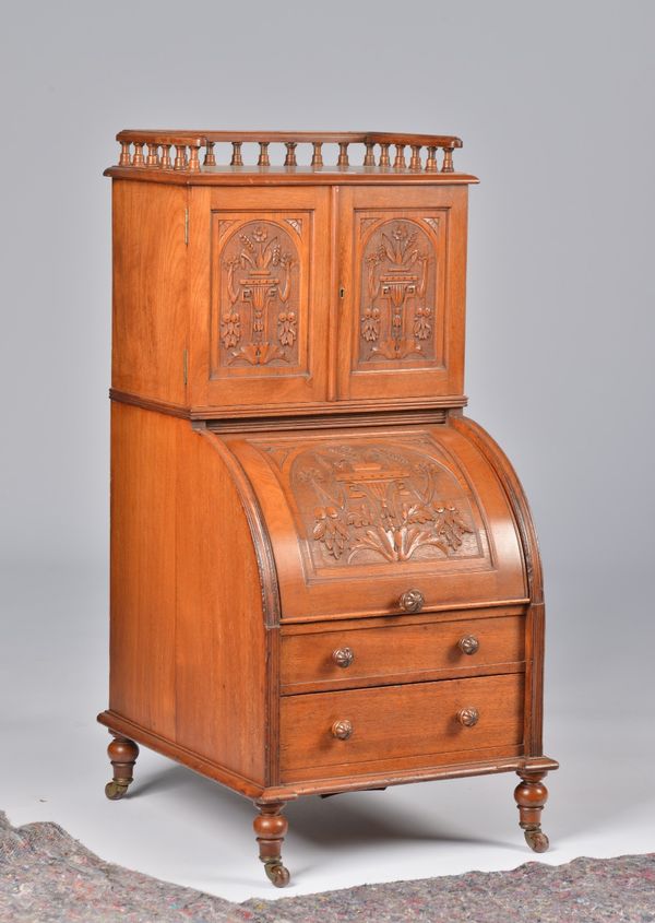 A VICTORIAN CARVED WALNUT COAL PURDONIUM