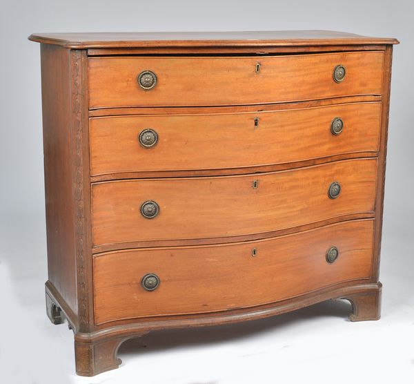 A GEORGE III MAHOGANY SERPENTINE CHEST