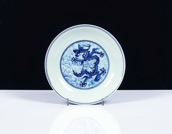 A CHINESE BLUE AND WHITE DRAGON DISH