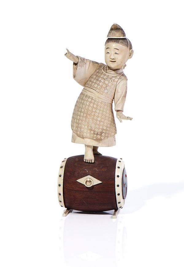 A JAPANESE IVORY OKIMONO OF A CHILD