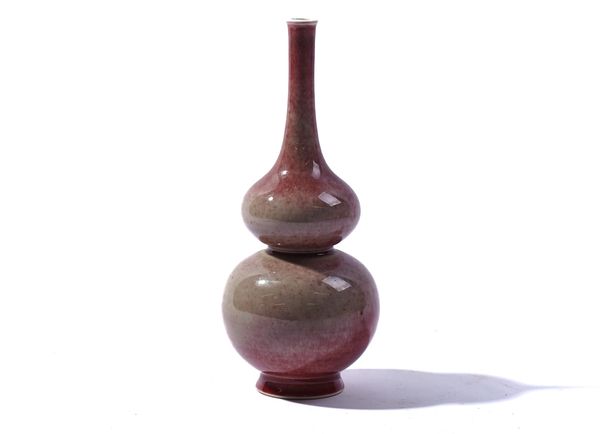 A CHINESE `PEACH BLOOM' GLAZED VASE