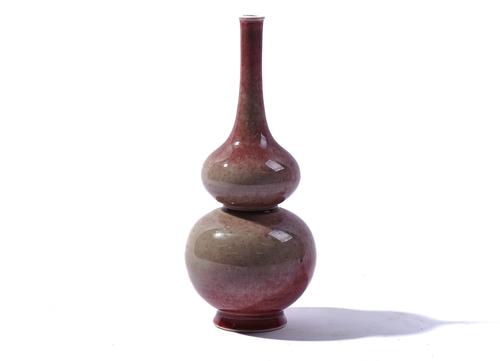 A CHINESE `PEACH BLOOM' GLAZED VASE