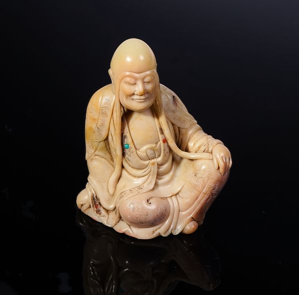 A CHINESE SOAPSTONE CARVING OF A LUOHAN