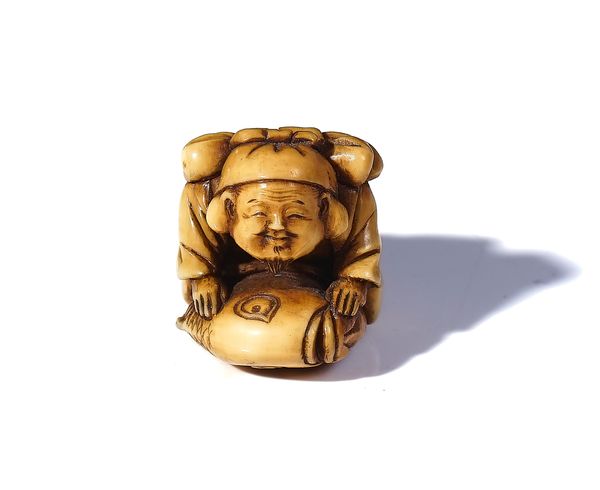 A JAPANESE IVORY NETSUKE OF EBISU