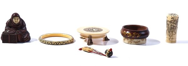 A GROUP OF JAPANESE IVORY AND WOOD WORKS OF ART